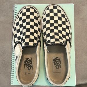 Women’s black and white checkered Vans